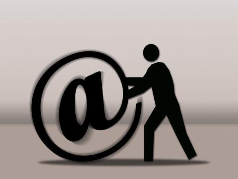 man pushing @ symbol